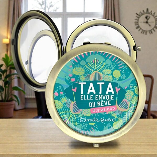 Un miroir de poche rond avec un message rigolo TATA Elle envoie du rêve